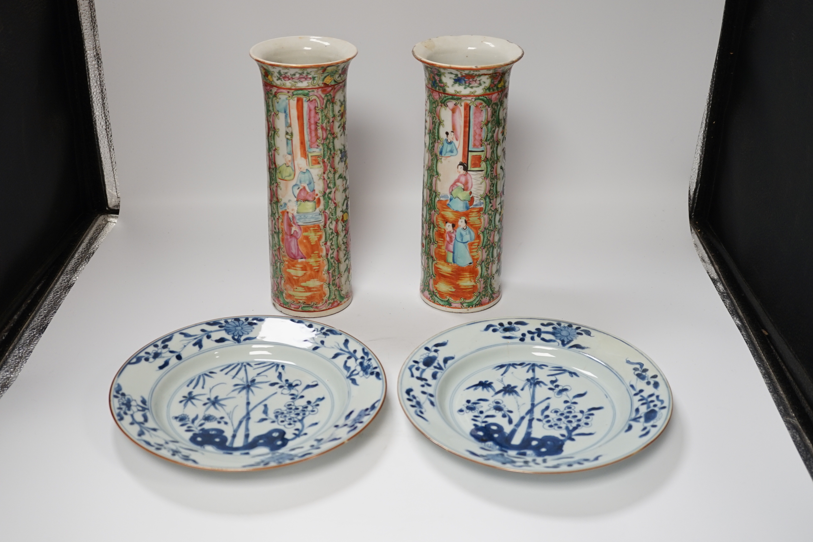 A pair of 19th century Chinese famille rose sleeve vases and a pair of 18th century Chinese blue and white plates, vases 26.5cm